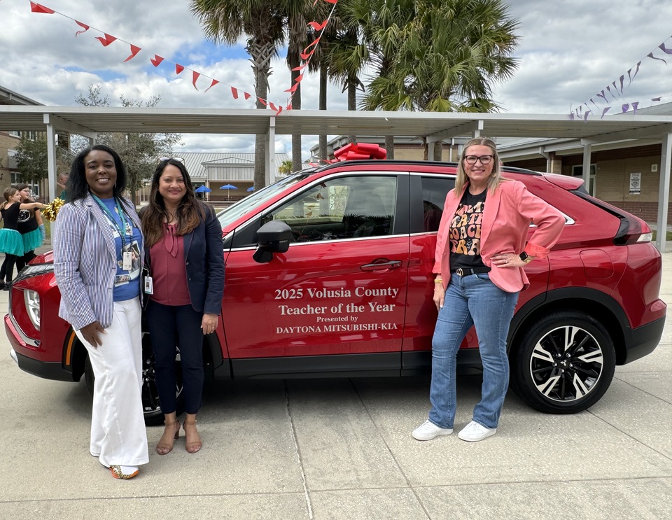 Champion Elementary Principal Angela Polite, Superintendent Dr. Carmen Balgobin, and Teacher of the Year Emily Fagerstrom.