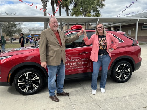 Daytona Mitsubishi and Daytona Kia Sales Manager Tom Gross and the Volusia County Schools 2025 Teacher of the Year Emily Fagerstrom.